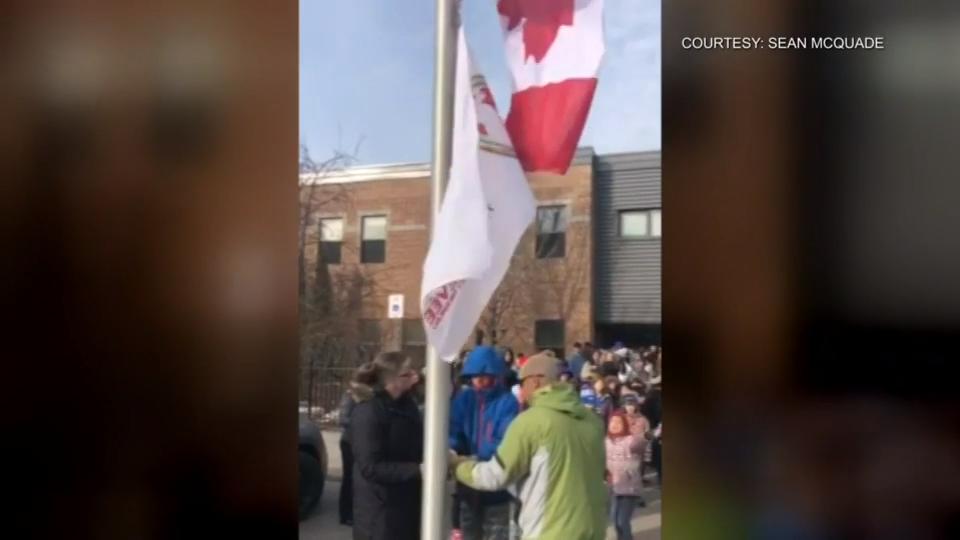 Flag raising outside Whitby school in honour of World Autism Awareness Day